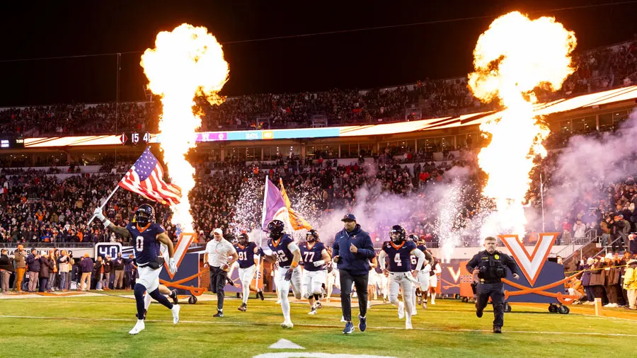 Football field players running with the flag