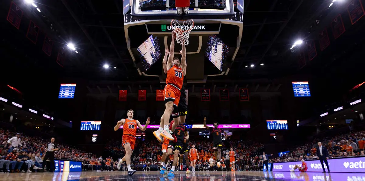 basketball player dunking on the court