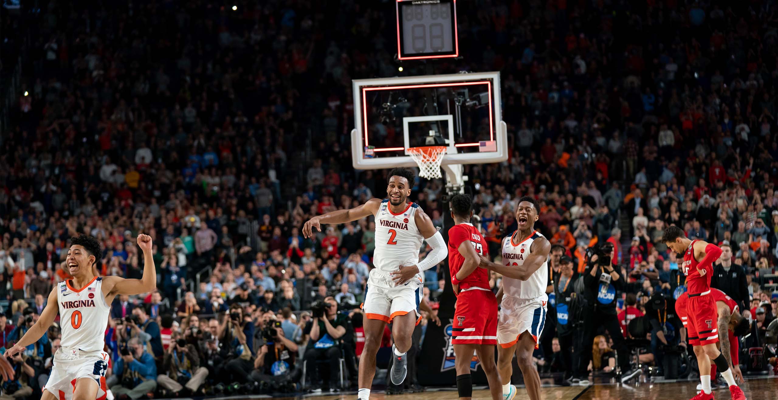 Basketball players celebrating on court